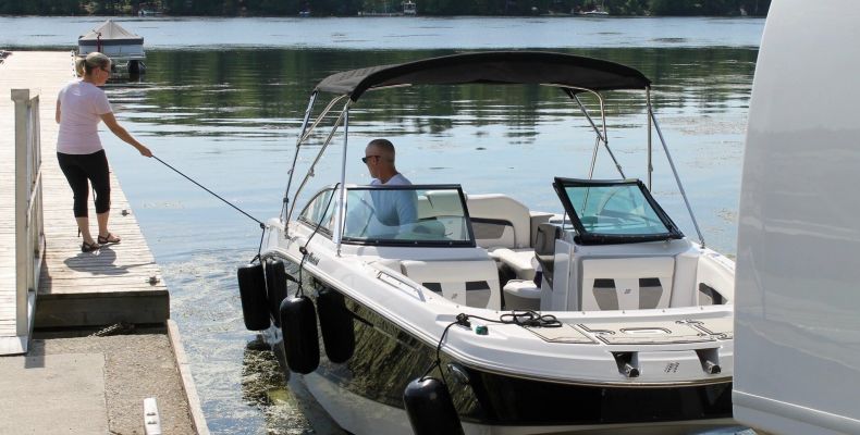 Couple launching boat, launch