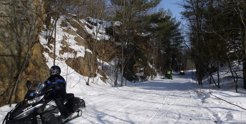 Snowmobilers on Cat Trails, winter