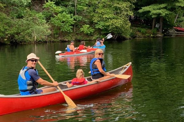 family-in-canoe-with-kayaks-in-background-amf0C982311-DAFC-B92F-E245-B2788E1F0024.jpg