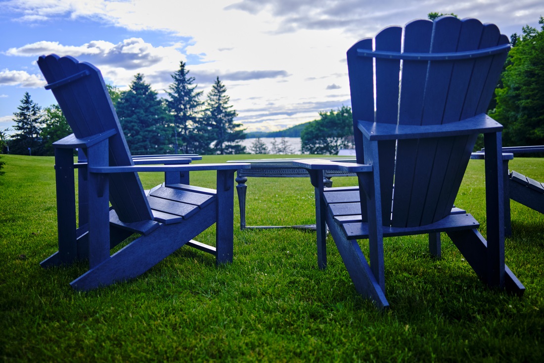 Blue Chairs by Rick Ogrodzinski Overlooking Sand Lake